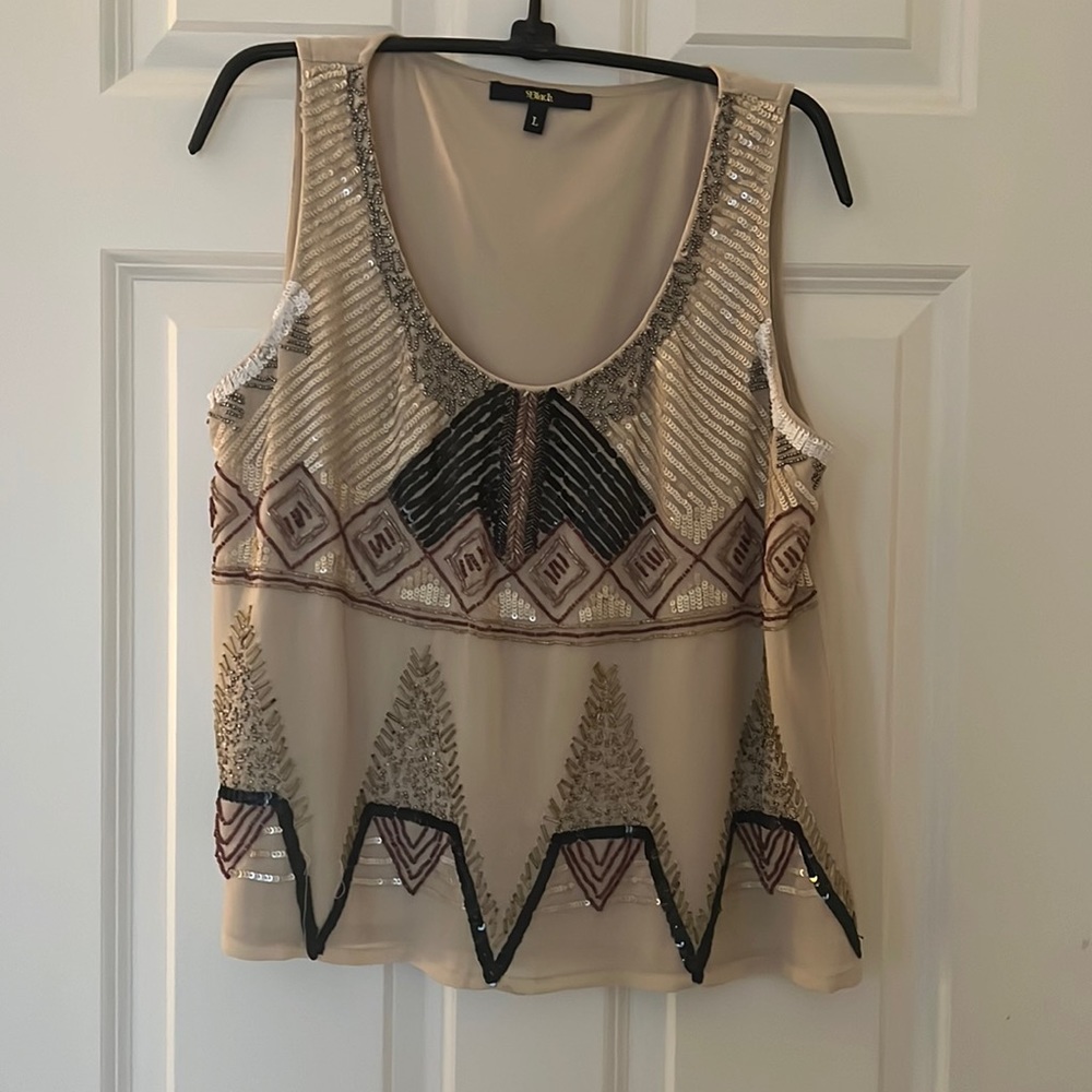Embellished top with beautiful sequence and beading detail. Size large.
